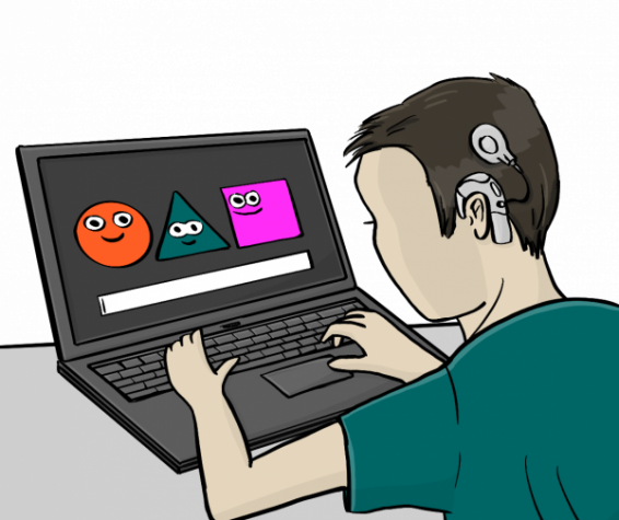 Eine Junge mit Cochleaimplantat ist am Laptop. Er besucht die Website von Gaming ohne Grenzen.
