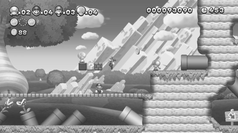 Screenshot aus einem Level. Die Figuren Mario, Luigi, Toadette und Toad sind zu sehen. Das Bild ist in Schwarz-Weiß.