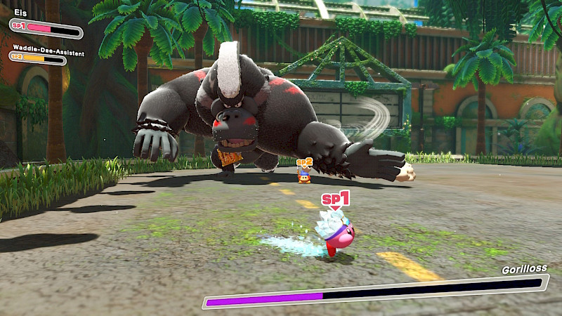 Kirby und der Assistent kämpfen gegen ein großes, Gorillaähnliches Monster.