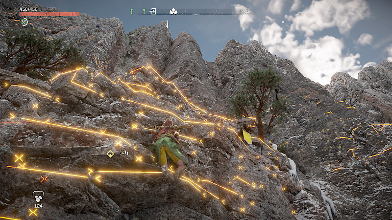 Ein Screenshot aus dem Spiel. Aloy klettert eine Steinwand hinauf. Die Stellen die sie beklettern kann, sind Orange leuchtend  markiert.